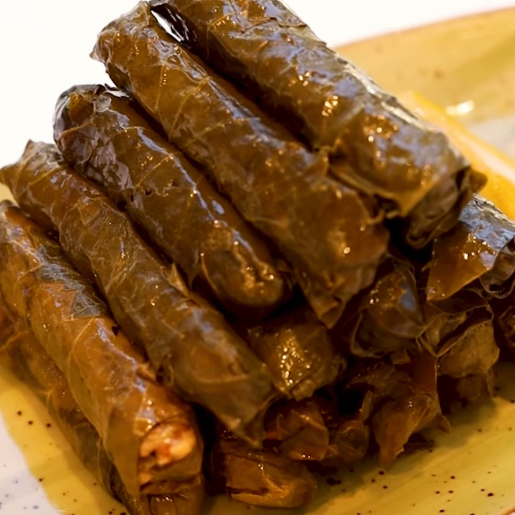 Stuffed Vine Leaves with sour, spicy, Olive Oil